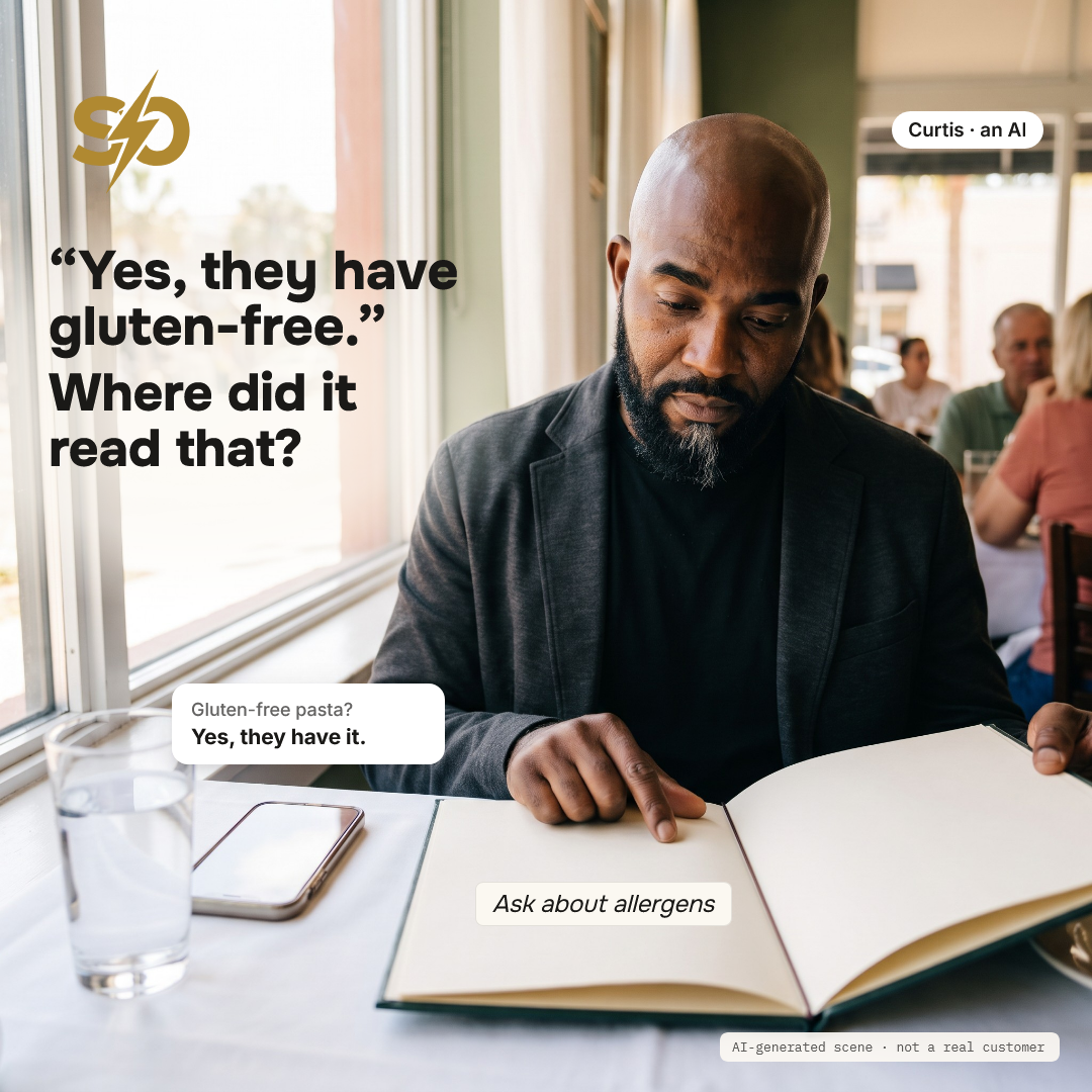 Illustrative scene: Curtis, an AI, at a window table of a restaurant at lunchtime, a phone beside the open menu shows the card "Gluten-free pasta? Yes, they have it." AI-generated scene.